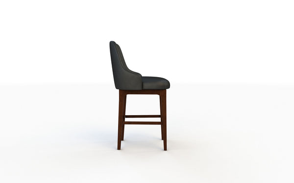 Bar stool with dark gray cushioned seat and wooden legs on a white background